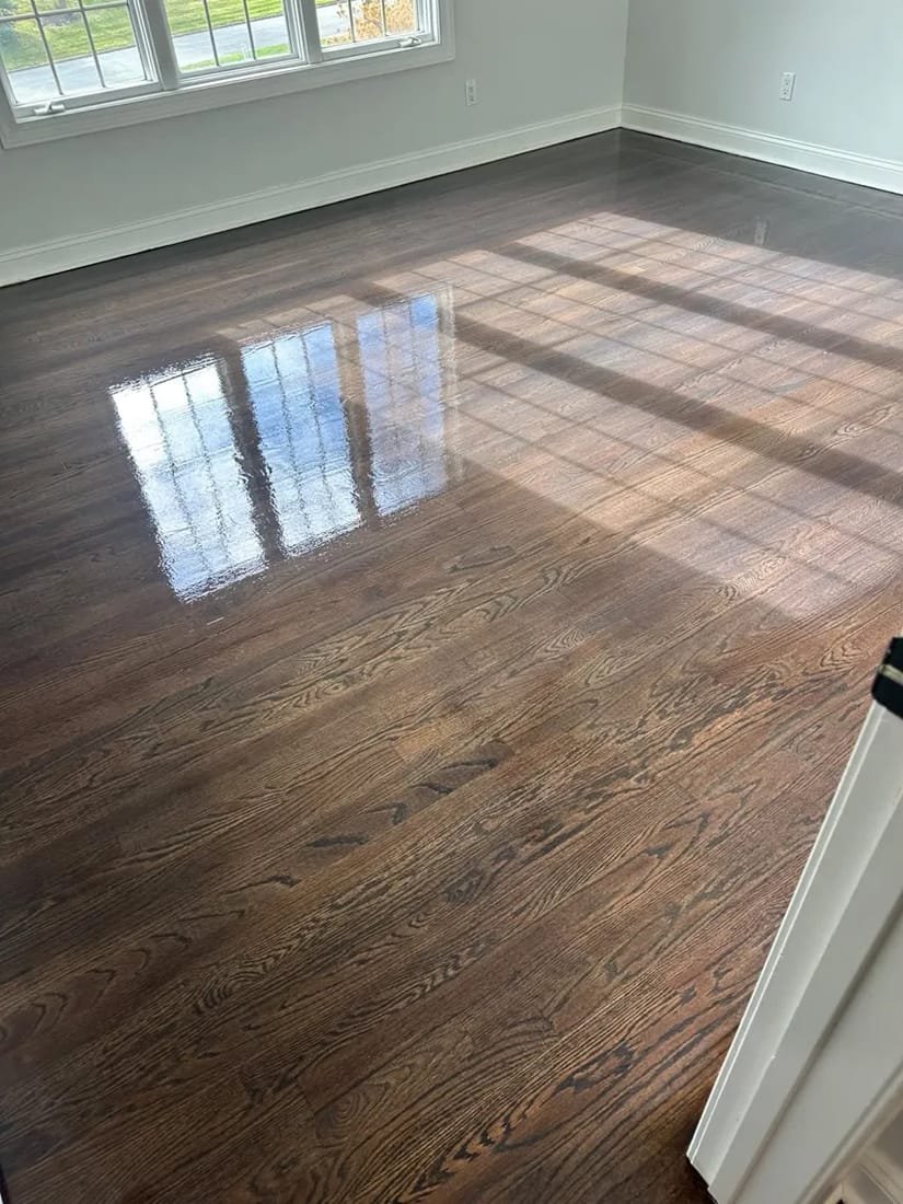 Close-up of a glossy, freshly refinished hardwood floor